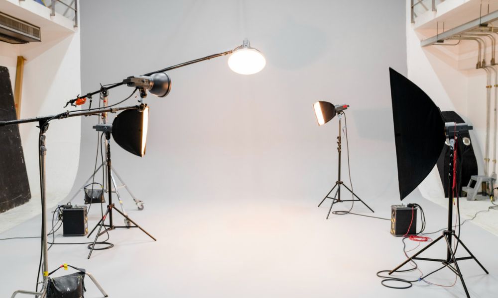 a photography studio with lighting equipments