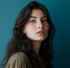 Portrait of a beautiful young woman against a blue background