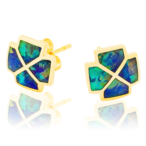 A pair of gold stud earrings, each featuring a square-like shape with four triangular sections filled with iridescent blue and green opal, are shown against a white background with a reflection (after shadow making service)