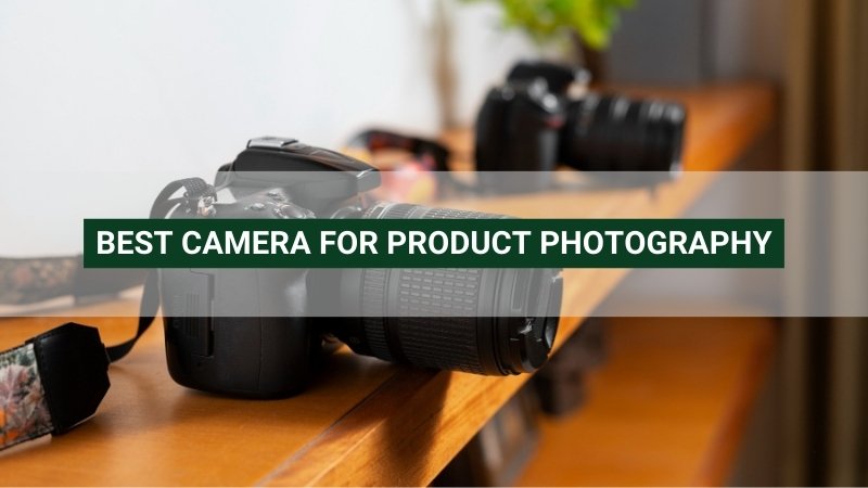 DSLR camera on a wooden surface with a blurred second camera in the background. Text: "BEST CAMERA FOR PRODUCT PHOTOGRAPHY"