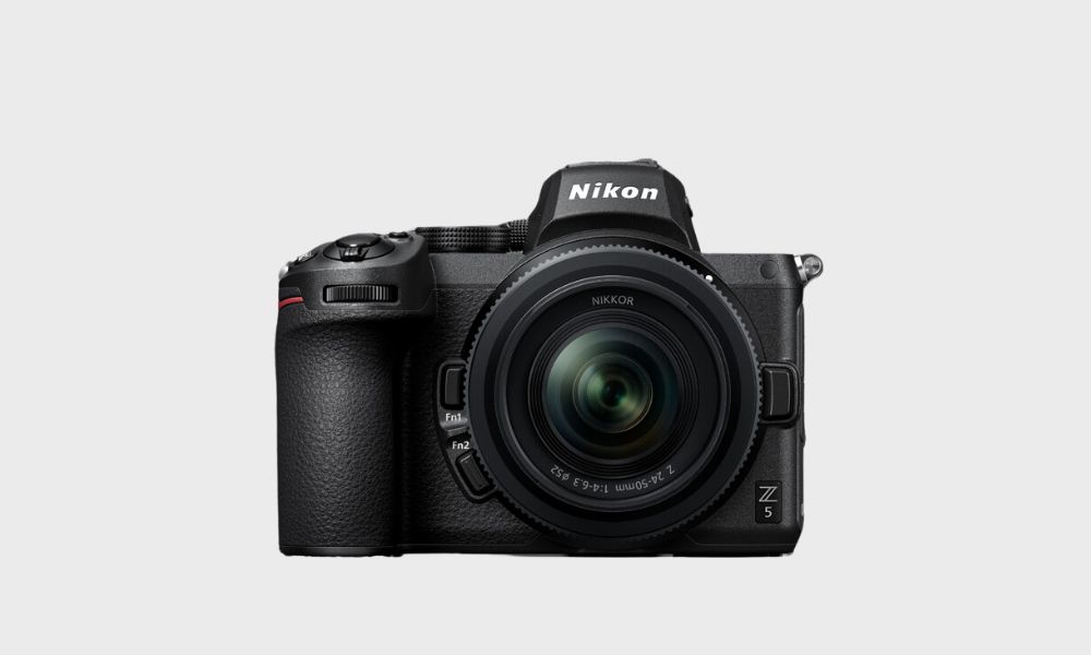 A black Nikon Z 5 mirrorless camera with a Nikkor Z 24-50mm f/4-6.3 lens attached is displayed front-on against a plain light gray background