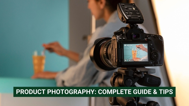 Camera on tripod, capturing a product shot of a drink, with a person adjusting props in the background. Text: "PRODUCT PHOTOGRAPHY: COMPLETE GUIDE & TIPS"