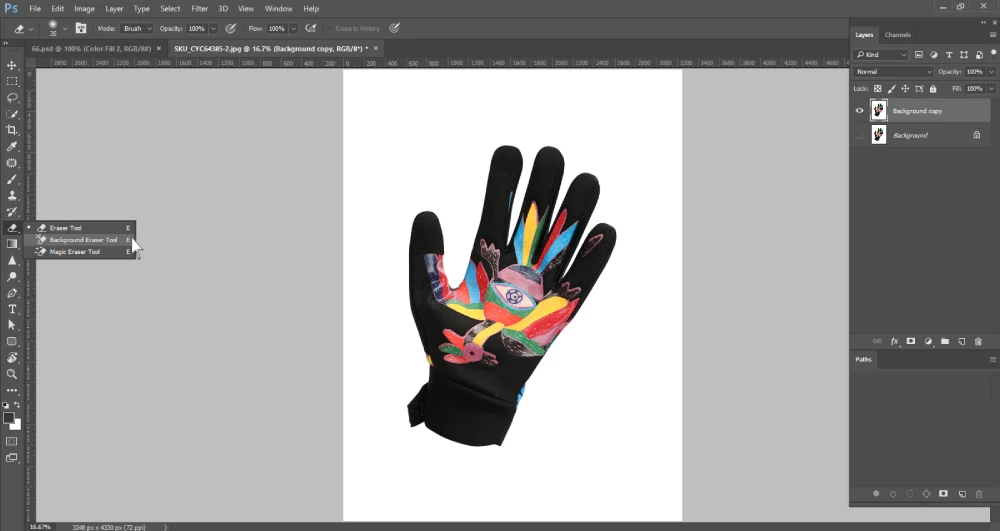 A Photoshop screenshot displays a black cycling glove with a colorful, artistic design on the palm, set against a white background. A dropdown menu from the toolbar on the left shows "Eraser Tool," "Background Eraser Tool," and "Magic Eraser Tool," with the "Background Eraser Tool" highlighted. The layers panel on the right contains "Background copy" and "Background" layers.