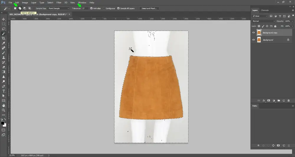 Screenshot of Adobe Photoshop showing the Magic Wand Tool in use. A selected area is highlighted with a dashed outline, indicating the portion of the image currently active for editing or masking