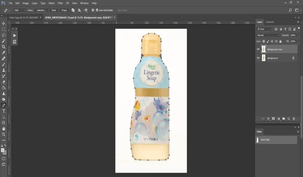 A screenshot of Adobe Photoshop shows a bottle of "Lingerie Soap" with a floral design, outlined with a path tool against a white background, indicating the start of creating clipping paths