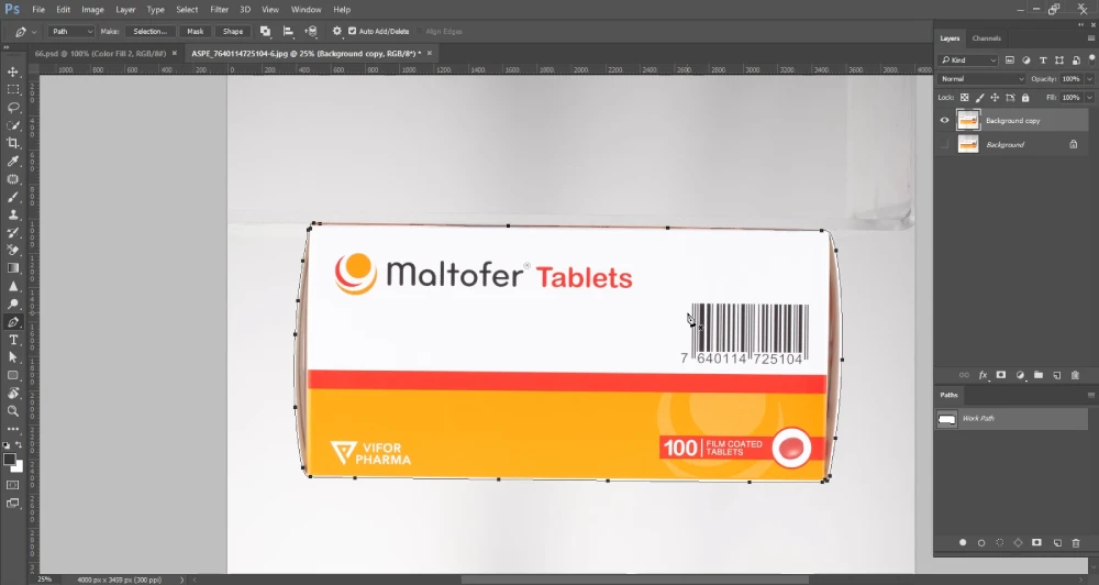 A Photoshop screenshot displays a white and orange box of "Maltofer Tablets" with a barcode, now fully enclosed by a path created with the Pen Tool. The path is visible as a thin line tracing the contours of the box, with anchor points at its corners. The "Paths" panel on the right shows "Work Path" listed, and the layers panel shows "Background copy" and "Background" layers