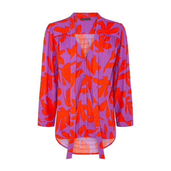 A long-sleeved purple blouse with a red leaf pattern and a tie-front detail, shown on an invisible mannequin with the bottom hem curving slightly