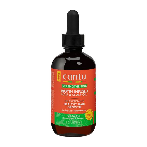 A bottle of Cantu Strengthening Biotin-Infused Hair & Scalp Oil, 3.2 fl oz / 95 ml, with a black dropper top and an orange and green label, isolated on a white background.
