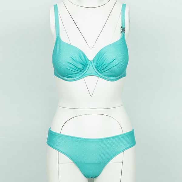 A turquoise two-piece bikini with a textured pattern, displayed on a white mannequin with visible construction lines