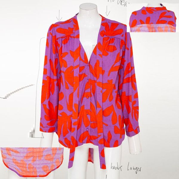 A long-sleeved purple blouse with a red leaf pattern and a tie-front detail, displayed on a mannequin with sketches and additional fabric swatches visible around it.