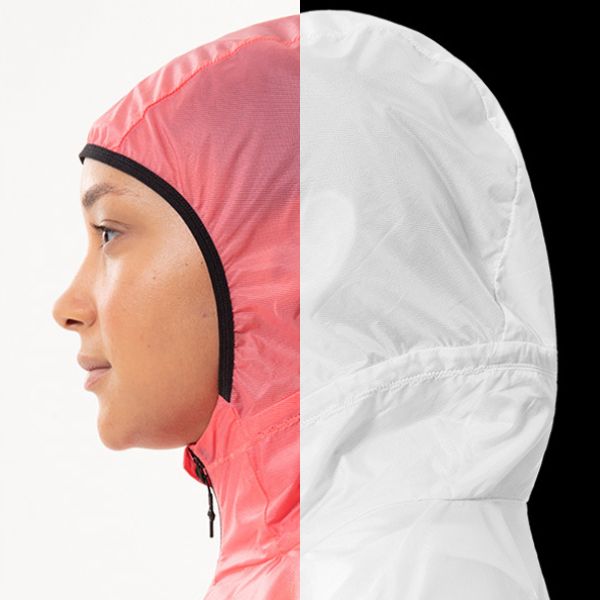 A "before and after" comparison showing the side profile of a person in a hooded jacket. The left half shows the jacket in pink with a white background, and the right half shows the same jacket in white with a black background, illustrating color correction